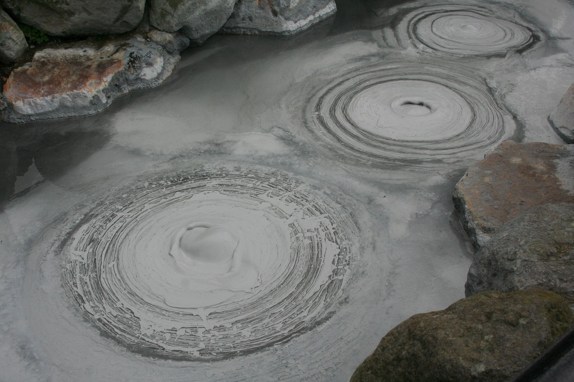 Volcanic coast with dramatic dark sands and waves